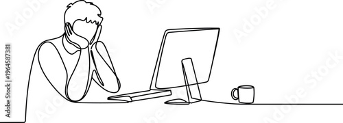 man sitting at desk with computer looking stressed or frustrated at work