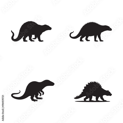 Silhouettes of prehistoric animals including dinosaurs and reptiles