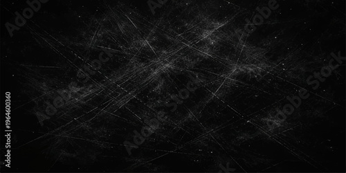 Scratched black background with white dust and grunge texture effect for vintage overlay.