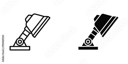 Comparison of a traditional and modern floodlight design in black and white illustration