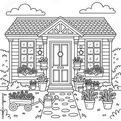 A house with a garden and a cart full of flowers in front