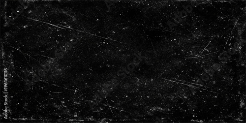 Abstract dark background featuring a heavy grain texture with white noise and subtle scratches.