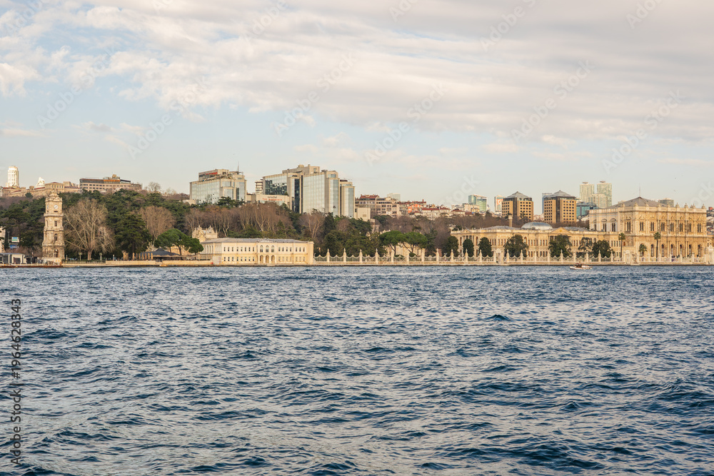 Fototapeta premium Dolmabahce Palace and Istanbul skyline across Bosphorus