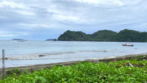 Beautiful beach views in the Sangihe Islands, North Sulawesi, Indonesia - january 30th 2026. White sand with open sea and coconut trees. 