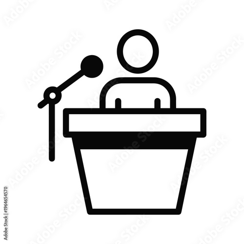 Person standing behind a podium holding a microphone, ready to address an audience or deliver a speech during an event
