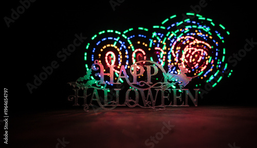 Halloween concept. Creepy silhouette in the dark corridor with pumpkin head. Toned light with fog on background.