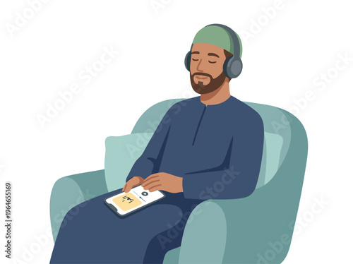 Muslim man listening to audiobook on tablet while relaxing in armchair.