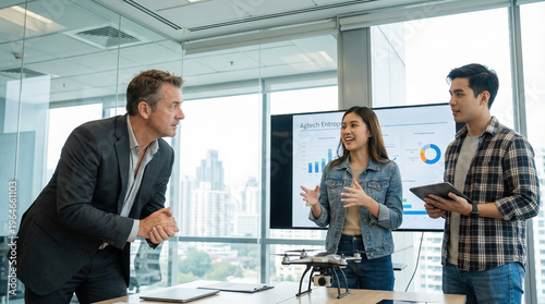 Business meeting with agribusiness professionals discussing technology and data in a city office