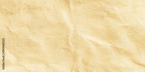 Crumpled brown paper texture background with wrinkles and creases for design and craft projects