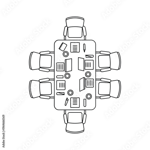 Overhead view of a rectangular conference table with office supplies