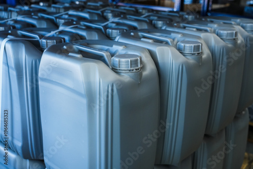Canvas Print Gray plastic canisters in rows.