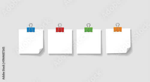 Four colorful binder clips attached to white sticky notes