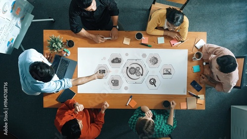 Valokuva Team Collaborating on Business Strategy with Infographics and Diagrams in Modern