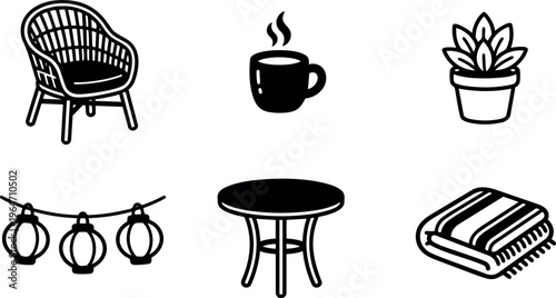 Chair coffee cup plant lantern string table and blanket