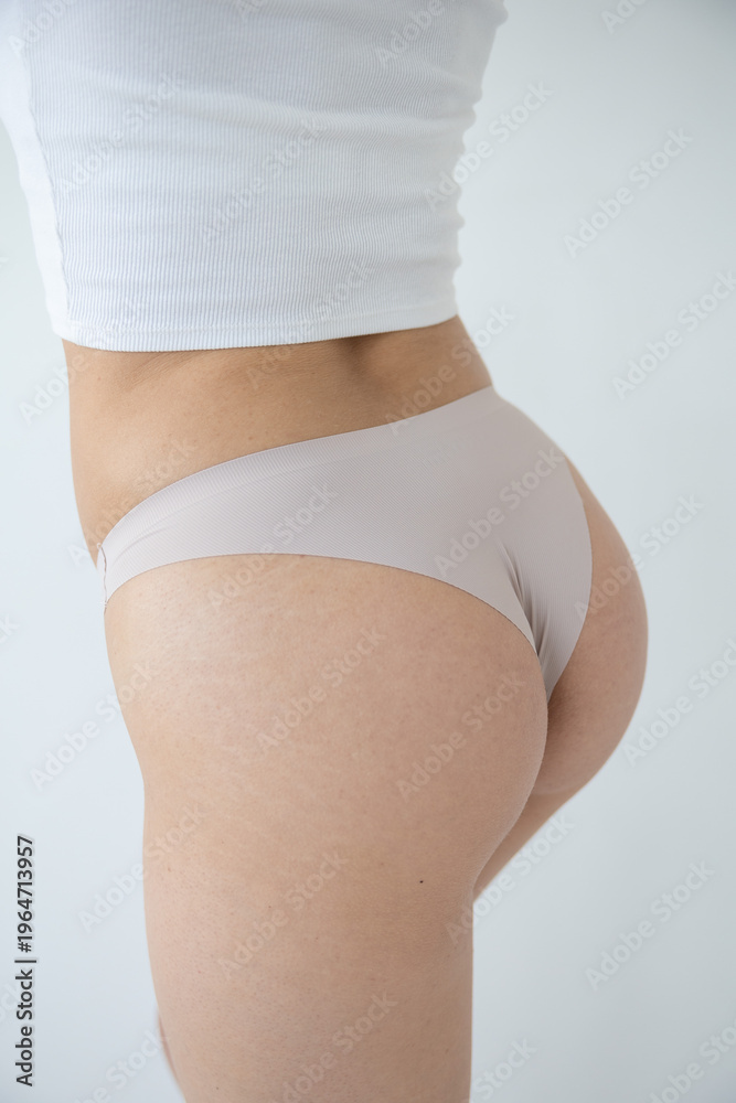 Fototapeta premium Close-up of beige underwear on a woman