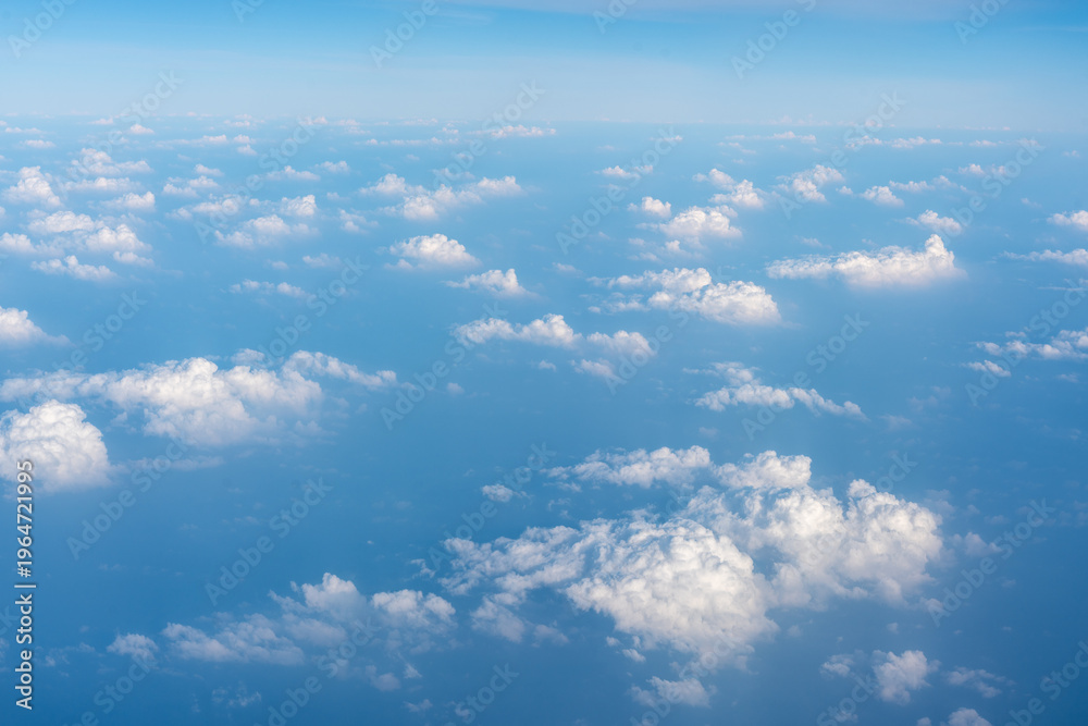 Naklejka premium Blue Sky with White Clouds, Flying above Sunny Cloudy Sky Texture Pattern Plane View