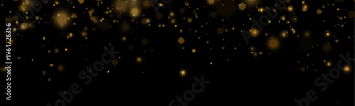 Shimmering golden dust floats gracefully on a dark transparent scene. Tiny particles sparkle softly in motion. Perfect for festive, holiday, and magical overlays.