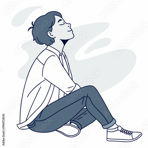 Young man sitting cross-legged with eyes closed and head up