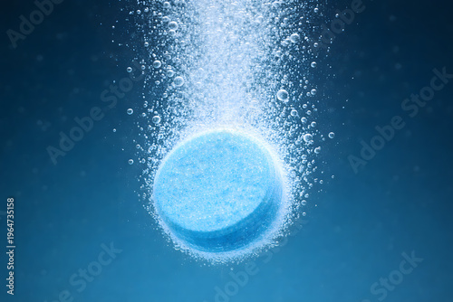 Effervescent Tablet Dissolving Underwater: A close-up shot captures the mesmerizing process of an effervescent tablet dissolving in water.