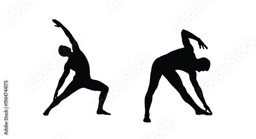 Two figures stretching in dynamic yoga poses a striking silhouette