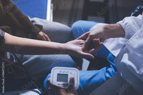 Bild auf Leinwand The doctor measures blood pressure to the patient