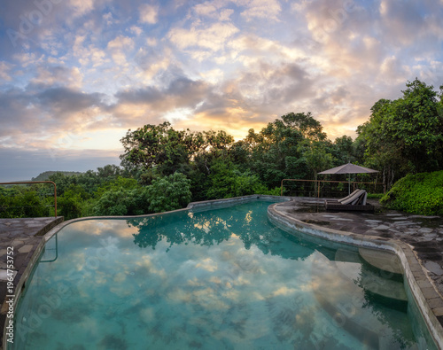 Sunrise over a peaceful secluded pool at the Galapagos Safari Camp - Highlands of Santa Cruz, Galapagos Islands