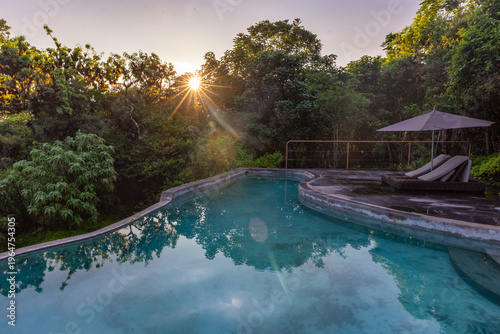Sunrise over a peaceful secluded pool at the Galapagos Safari Camp - Highlands of Santa Cruz, Galapagos Islands
