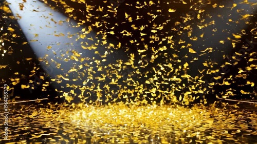 Golden confetti cascades onto a glowing festive stage as a spotlight beam cuts through the night-time event room.