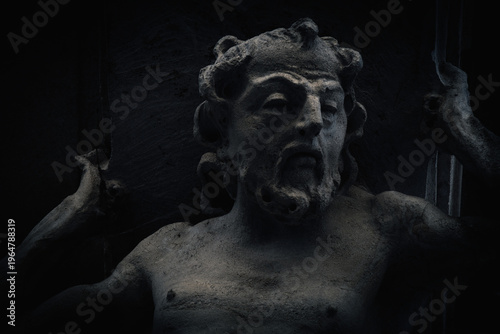 Obraz na plátně Dark statue inspired by Sisyphus myth, symbolizing endless struggle, burden, and human perseverance in a dramatic and shadowy underworld atmosphere