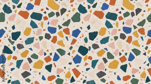 Colorful terrazzo pattern with irregular geometric shapes in pastel and vibrant tones perfect for backgrounds and surfaces
