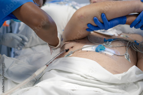 Medical professional assisting patient in recovery room