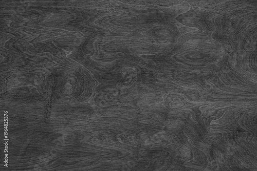 Black color painted wooden texture with horizontal natural grain pattern and smooth plywood surface. Rustic wallpaper, background, design element, backdrop