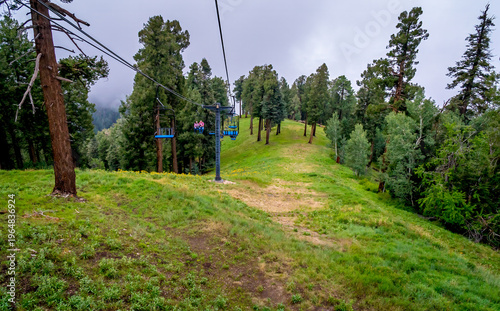 Ski lift in the clouds and fog on a summer day in the Santa Catalina Mountains near Tucson Arizona