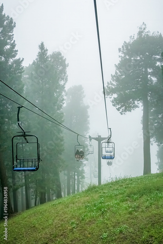 Ski lift in the clouds and fog on a summer day in the Santa Catalina Mountains near Tucson Arizona