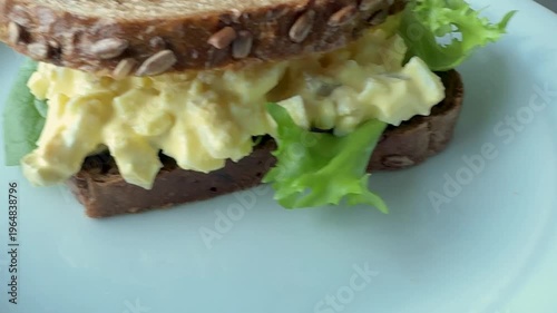Serving an Egg Salad Sandwich with Wheat Bread