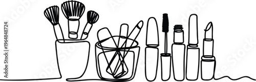 A set of makeup brushes and makeup products on a clean surface with white background