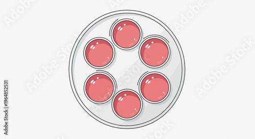 A petri dish with pink rounded objects.