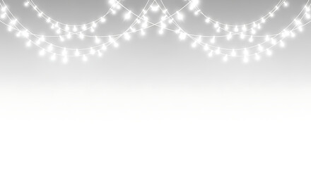 Decorative string lights and fairy light garlands on a light grey and white gradient background with copy space with christmas lights