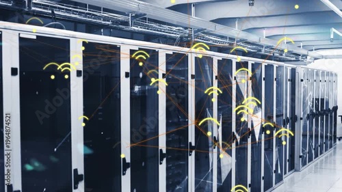 Net monitor detecting spike, firing wireless nodes over data racks for analysis, IT lead gesturing
