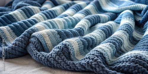 A Luxurious Textured Knit Throw Blanket in Shades of Blue and White
