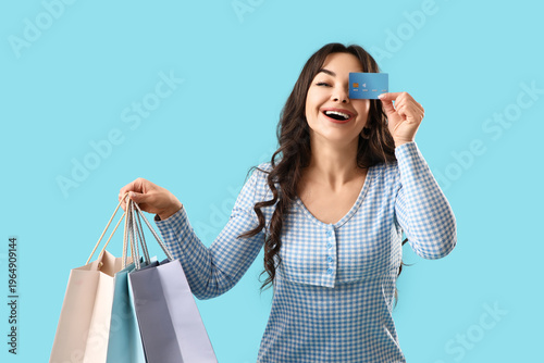Smiling young woman holding...