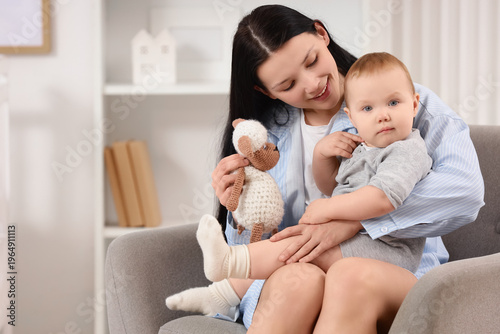 Young mother with toy sheep...