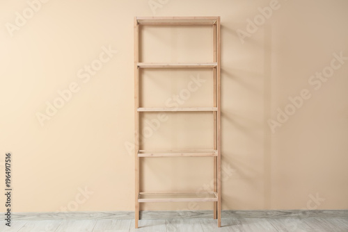 Empty bookshelf near beige ...