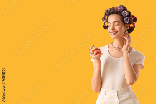 Young woman with hair curle...