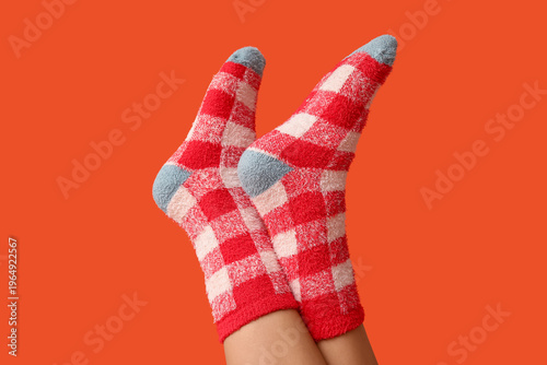 Legs of young woman in warm...