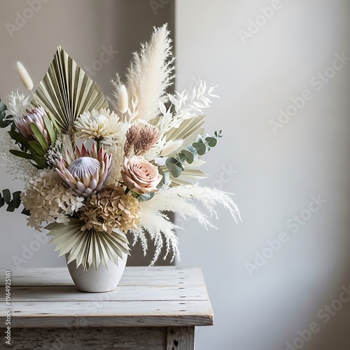 Sophisticated dried flower arrangement centerpiece in neutral color scheme