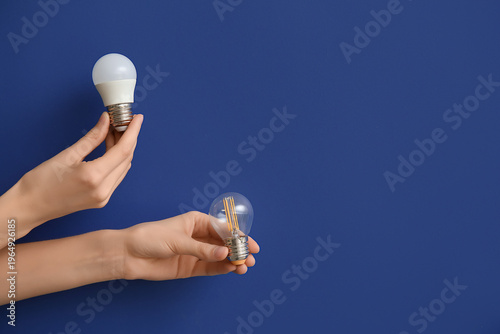 Female hands with light bul...