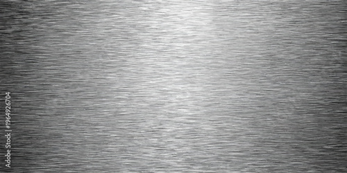 Industrial brushed metal texture background featuring a shiny silver stainless steel plate surface with a metallic grey chrome pattern and reflective aluminum material sheet