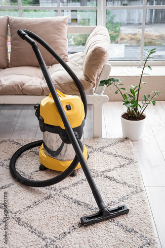 Modern vacuum cleaner on ca...