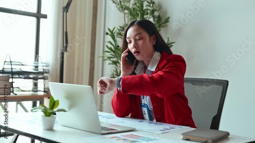 Angry businesswoman arguing on the phone in office